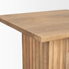 Close-up shot focusing on the smooth finished edge of the square top and the top section of the fluted base