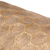 Close up of detailed gold hammered honeycomb texture on cylindrical base