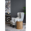 Lifestyle shot of Kiran accent table paired with a modern chair and decor