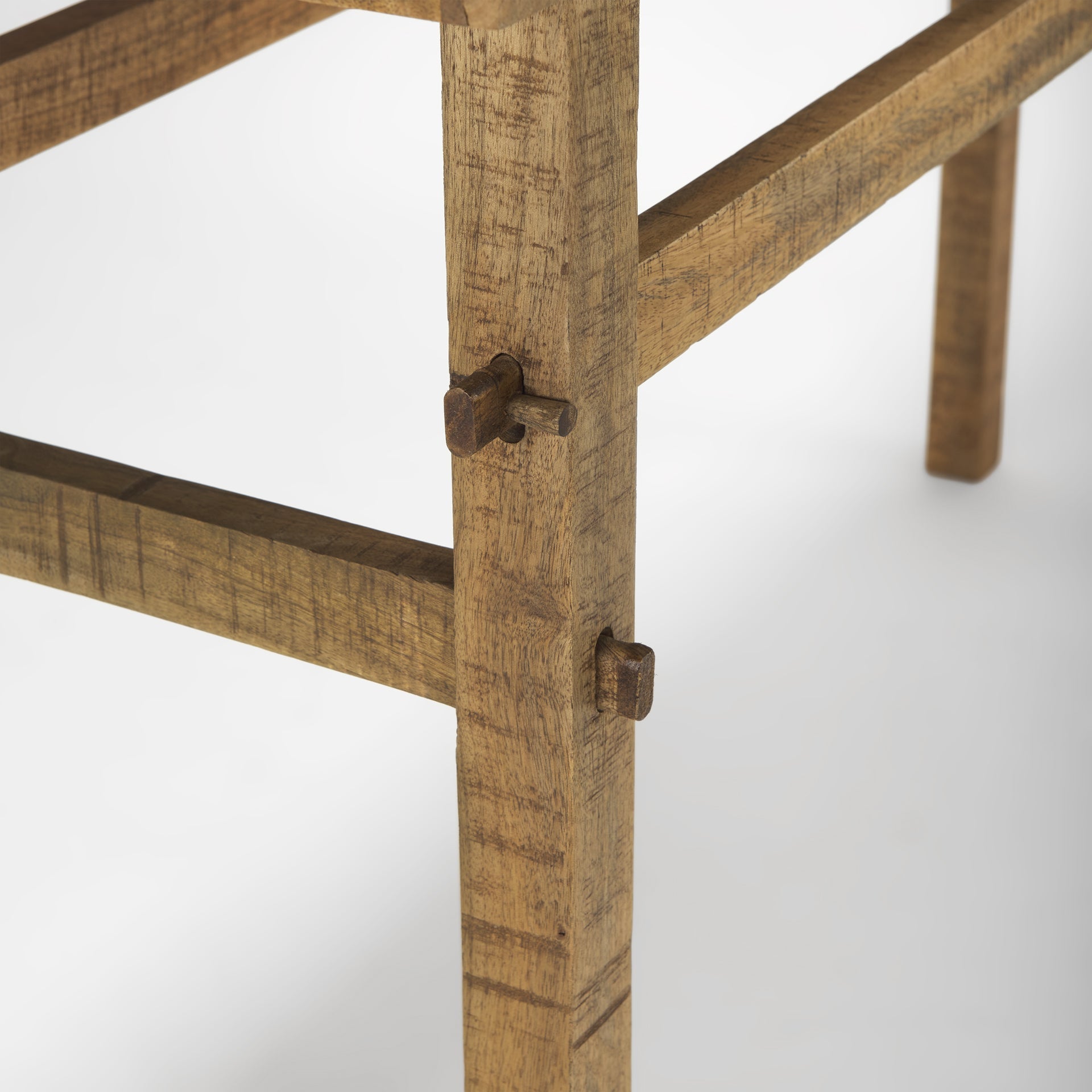 Front view of the Rosie console table in a light natural mango wood finish featuring a minimalist double-tier design