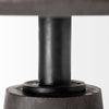 Macro detail shot showcasing the smooth black wood finish and contemporary form of the tapered pedestal base