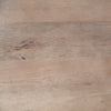 Three-quarter perspective view of the Maxwell table variant in a dark black wood finish with a black metal pedestal neck