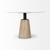 Close-up perspective focusing on the black metal neck transition between the white marble top and the light wood base