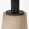 Detailed shot focusing on the lower portion of the tapered pedestal base in a light natural wood finish