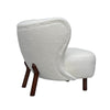 Side profile highlighting the distinct curved frame and sturdy tapered oak legs