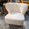 A wide shot showing the Mellow chair as part of a sophisticated lounge seating arrangement