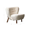 The Mellow chair styled in a high-end showroom setting next to a modern side table
