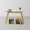 Lifestyle shot showcasing the Colton console used as a slender home office desk with a modern chair and neutral decor