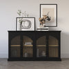 Lifestyle shot featuring the black cabinet styled with neutral accents in a modern living space