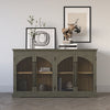Lifestyle shot featuring the grey Archdale cabinet styled with minimalist artwork and books in a bright contemporary room