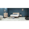 Wide lifestyle shot featuring the Gia bed styled with neutral bedding in a bright, contemporary bedroom
