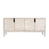 Three-quarter perspective view highlighting the clean architectural lines and slim wooden legs of the whitewashed sideboard