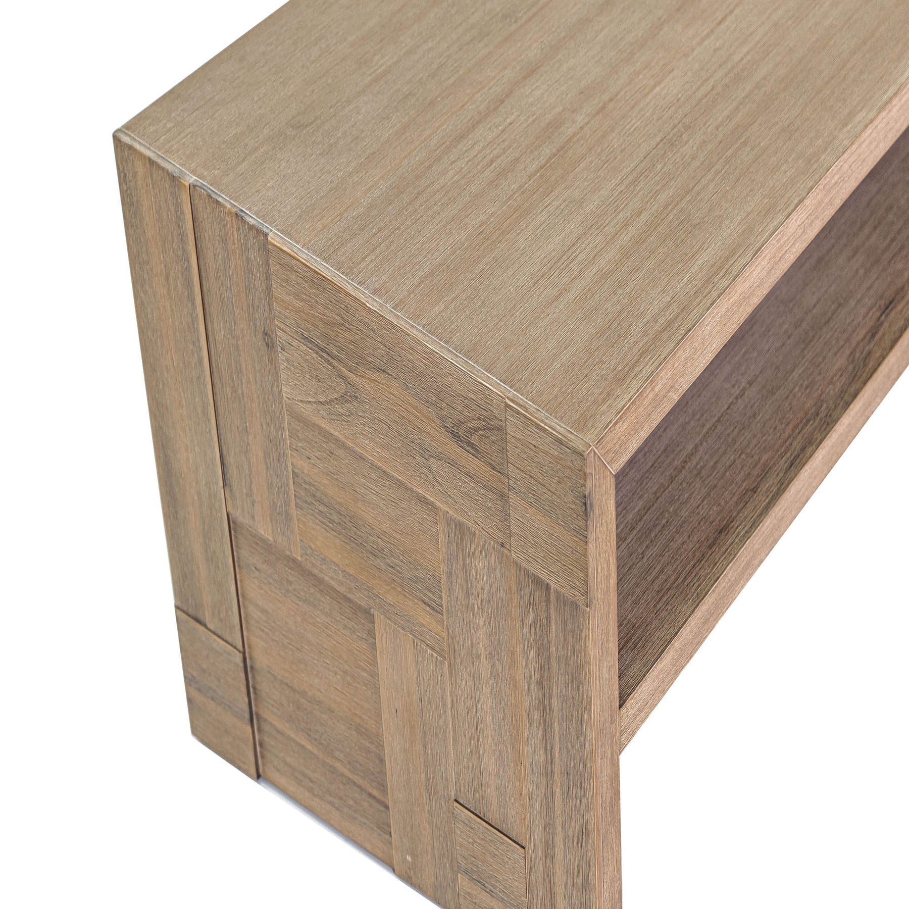 Front view of the Atlantis side table featuring a rectangular block silhouette with an open storage shelf and a light natural wood finish