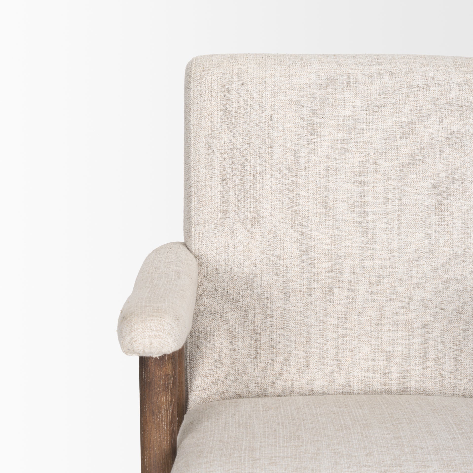 Front view of the Nico Accent Chair featuring oatmeal-colored textured fabric and dark-stained tapered wood legs
