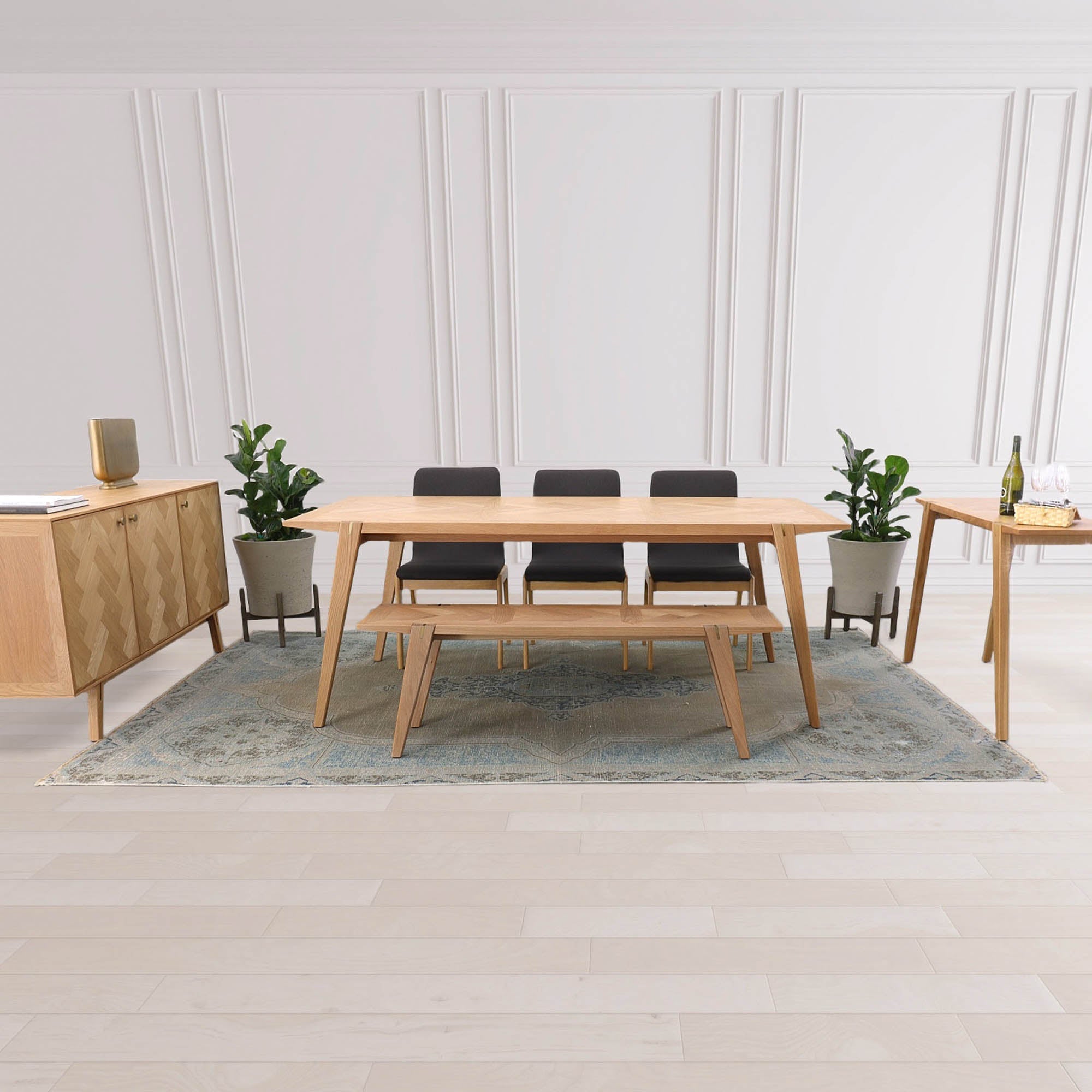 Front view of the Colton console table in natural oak featuring a minimalist design with slim tapered legs and exposed joinery