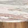 Close-up shot of the pink marble top edge meeting the natural mango wood pedestal base