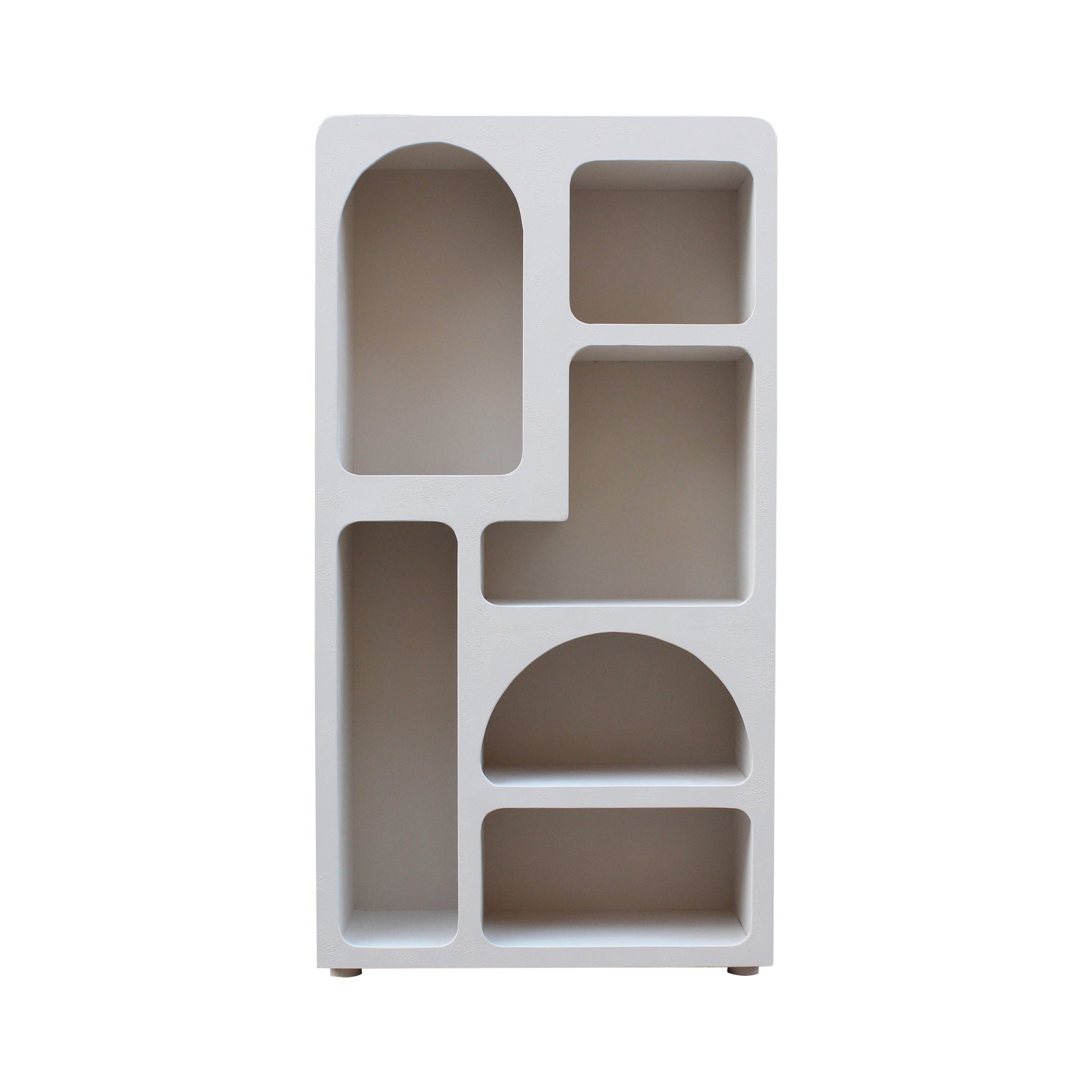 Straight-on front view of the Rena bookshelf featuring a unique asymmetrical layout with arched and rectangular open display cubbies in a matte white finish