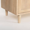 Macro shot focusing on the sturdy tapered wood feet and the reinforced base construction of the sideboard