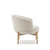 Side profile showcasing the architectural light oak legs and the wrap-around armrest design