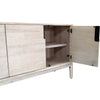 Perspective interior view focusing on the deep storage compartments and the seamless whitewash finish