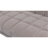 Macro close-up of the plush grey velvet fabric and the precise grid tufting on the Stella chair