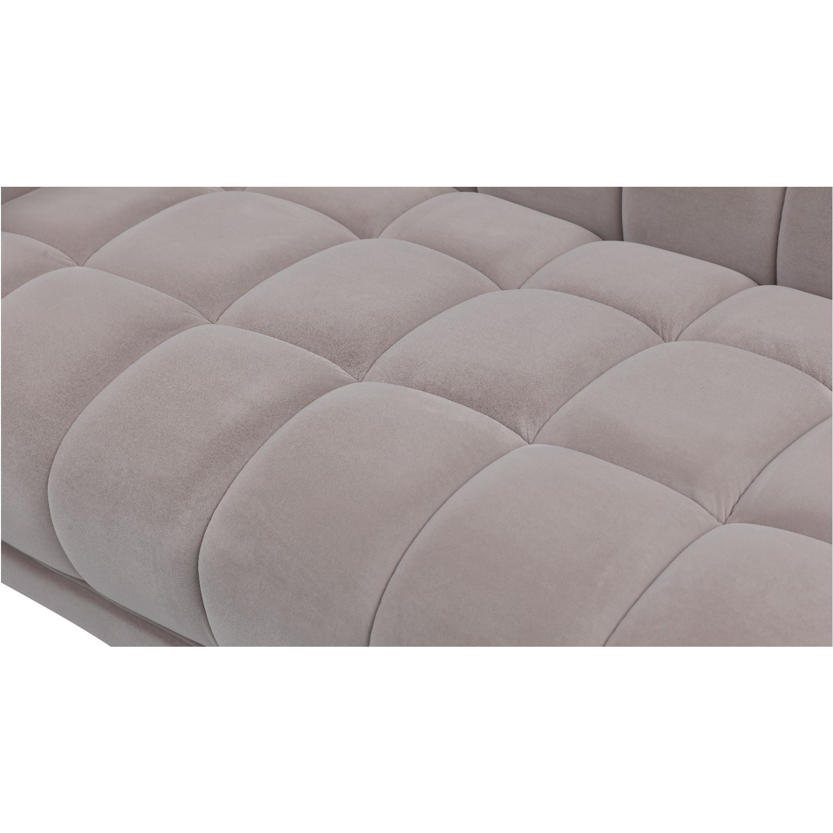 Macro close-up of the plush grey velvet fabric and the precise grid tufting on the Stella chair