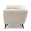 Right side profile of the Stella Loveseat showing the deep-seated silhouette and tapered legs