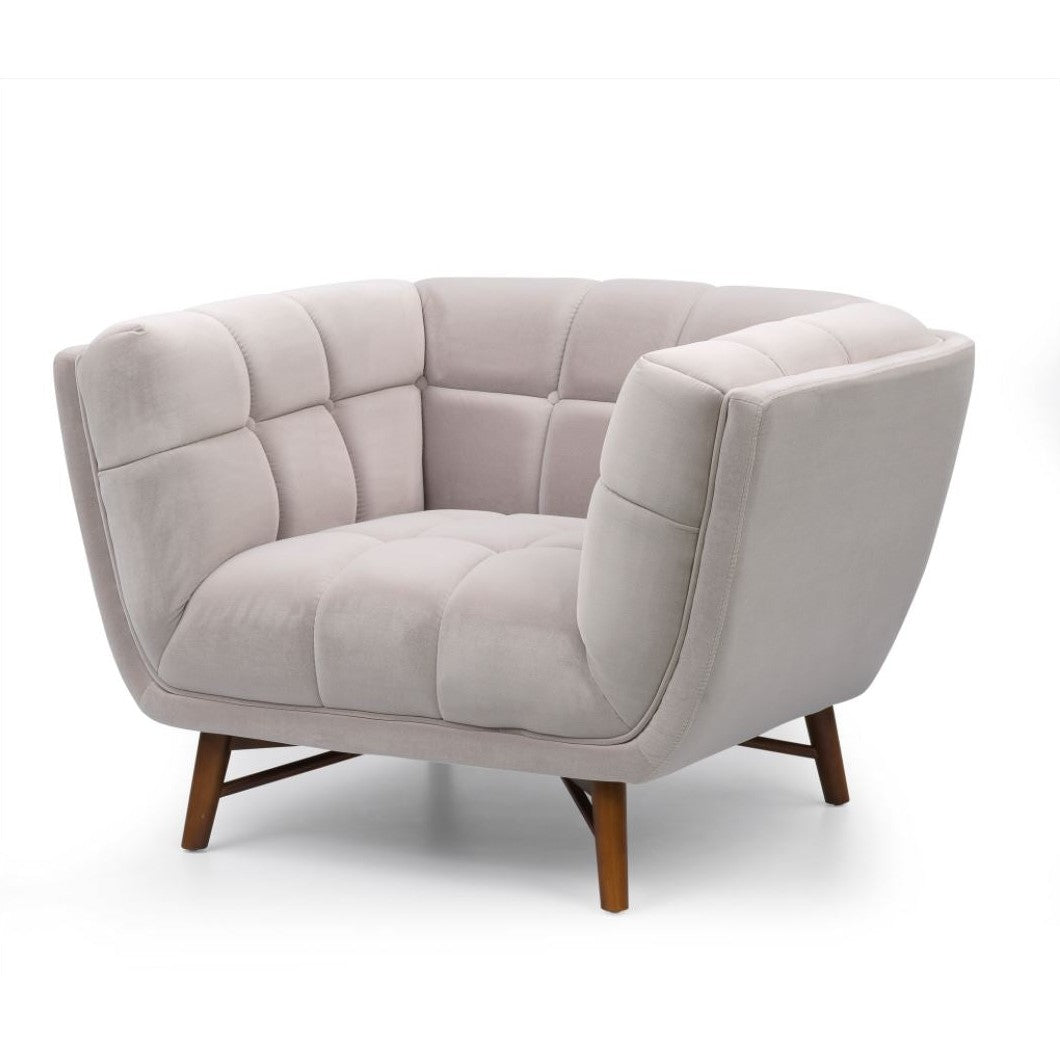 Three-quarter perspective of the grey Stella chair highlighting the wrap-around tufted backrest
