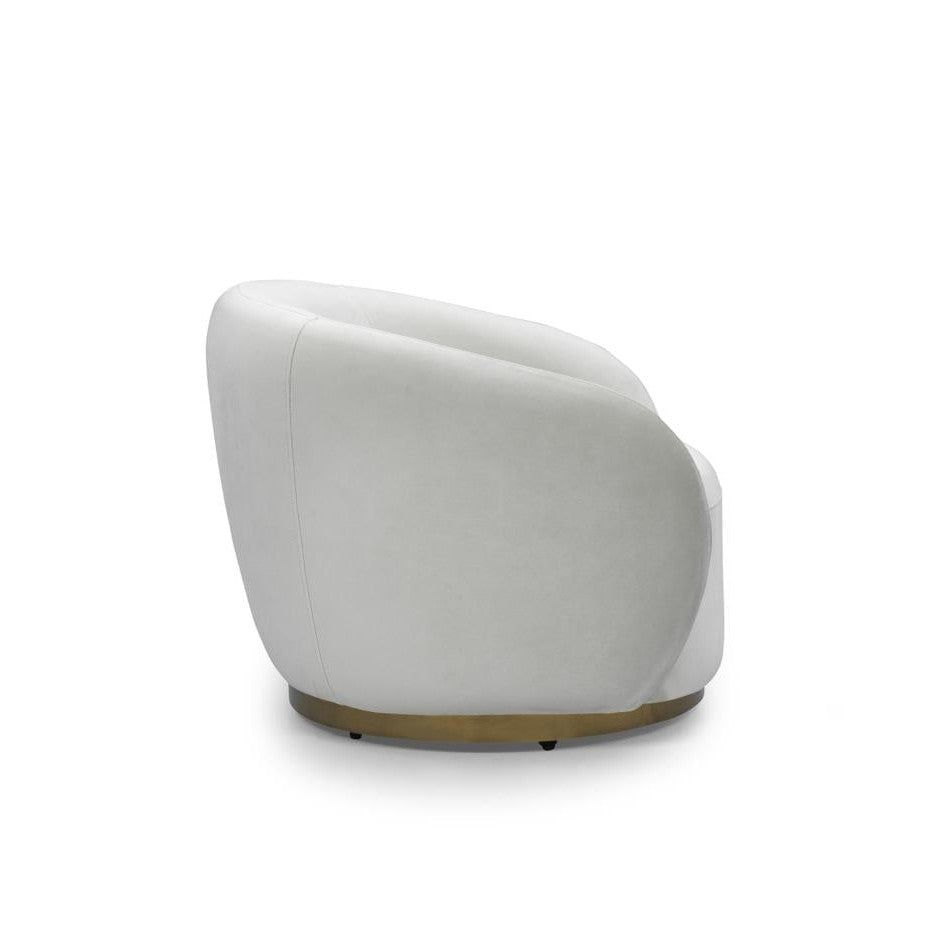 Front view of the Sumi Accent Chair in champagne velvet with a recessed circular gold swivel base