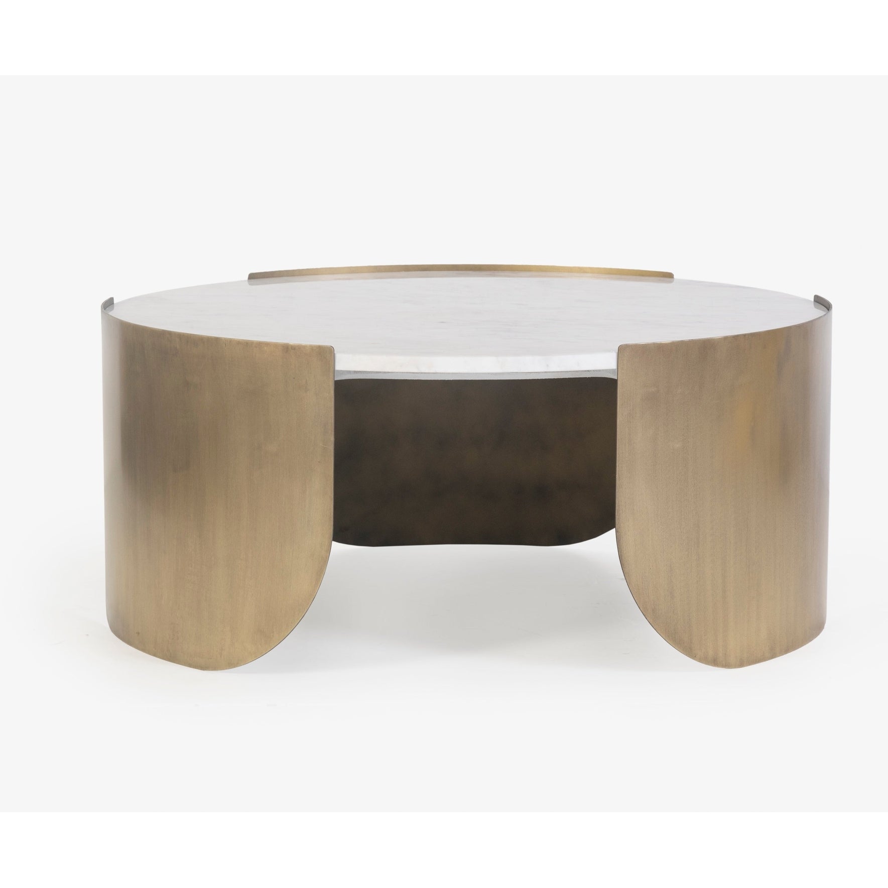 Front view of the Verker coffee table featuring a thick circular white marble top with subtle grey veining and an antique brass curved metal base