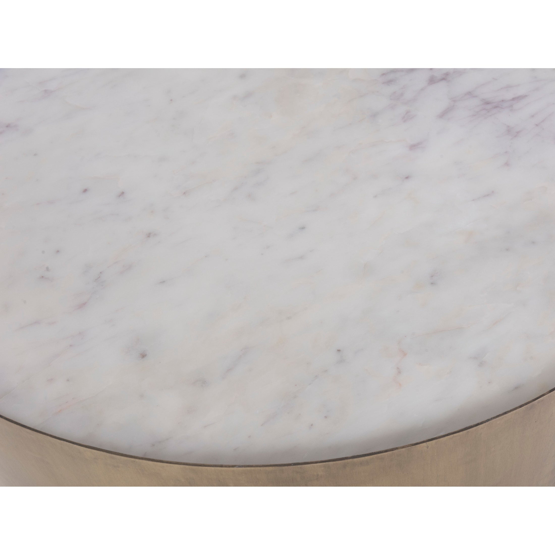 Front view of the Verker coffee table featuring a thick circular white marble top with subtle grey veining and an antique brass curved metal base