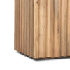Macro shot focusing on the rhythmic vertical grooves and natural mineral streaks of the mango wood base