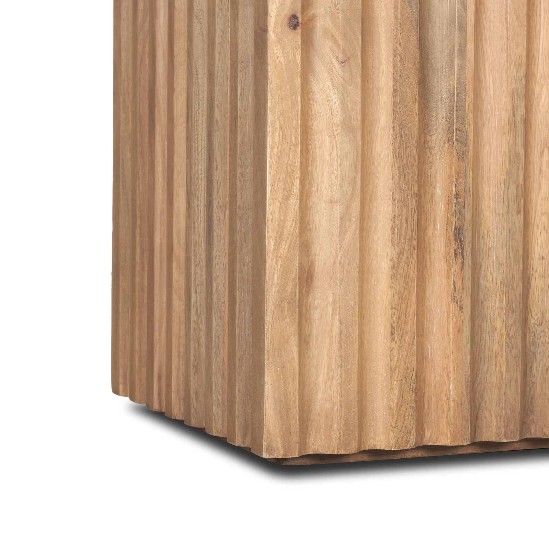 Perspective view of the June side table featuring a square tabletop and a thick square fluted pedestal base in natural mango wood