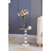 Villa side table styled with a floral vase in a modern living room